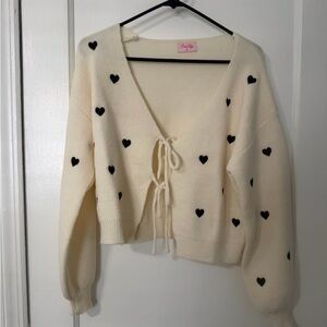 Pink Lily Cream V-Neck Sweater with Black Heart Details